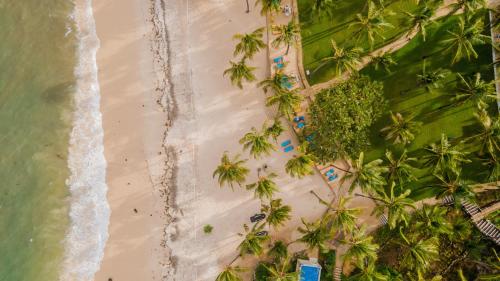 an overhead view of a beach with palm trees at PrideInn Flamingo Beach Resort & Spa Mombasa in Mombasa