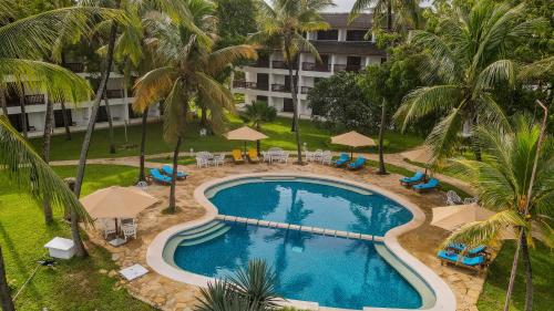 an overhead view of a swimming pool at a resort at PrideInn Flamingo Beach Resort & Spa Mombasa in Mombasa
