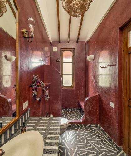 a bathroom with a toilet and a sink at Villa Fado - 4BHK Luxury Villa with Big Private Pool, Kitchen, Balcony, Patio, Caretaker, Power Backup, Security & WiFi located closer to Vagator Beach in Assagao