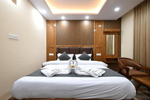 a hotel room with two towels on a bed at 2 bedrooms Sun Rise Pvt balcoy by Humble Stay in Cheog