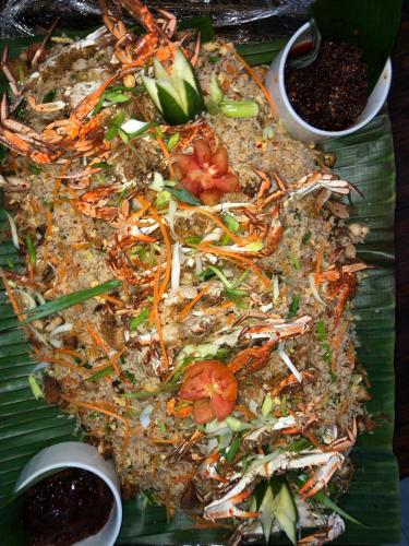 a plate of food with vegetables and other foods at Capital Wind Beach Cabanas in Kalpitiya