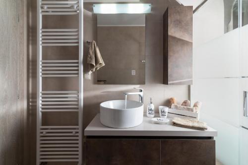a bathroom with a sink and a mirror at Silva Luxury House in Mires (South Crete) in Moírai