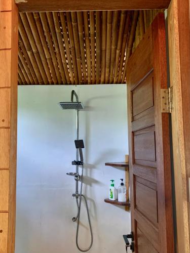 a bathroom with a shower in a room at Sagga Homestay in Katiet