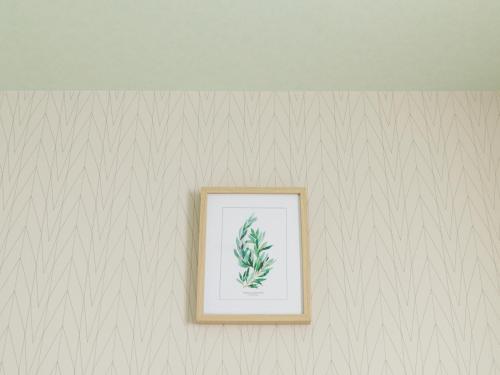 a picture of a plant in a picture frame on a wall at Nishitetsu Inn Tenjin in Fukuoka
