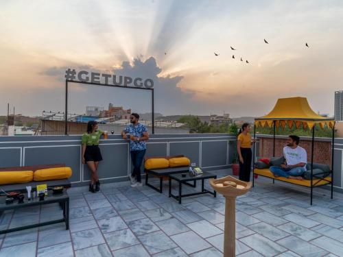 a group of people standing on top of a roof at The Hosteller Jodhpur in Jodhpur