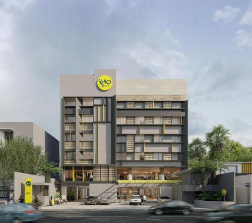 a large building with a yellow smileys sign on it at Yello Hotel Samarinda in Samarinda