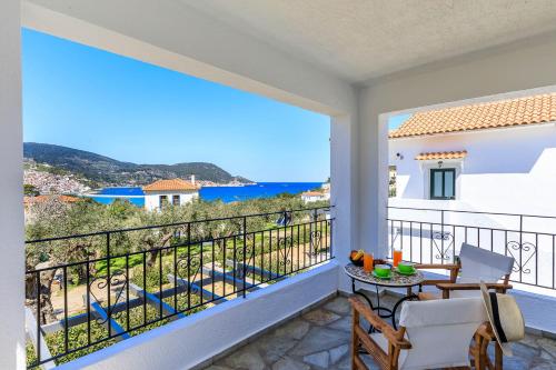 a balcony with a view of the ocean at Marani Home & Villas in Skopelos Town