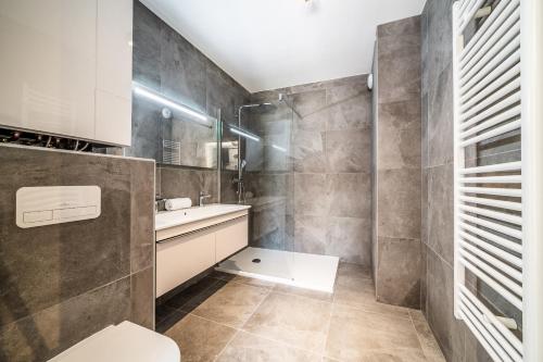 a bathroom with a toilet and a sink at Apartment Montami, Châtel - by EMERALD STAY in Châtel