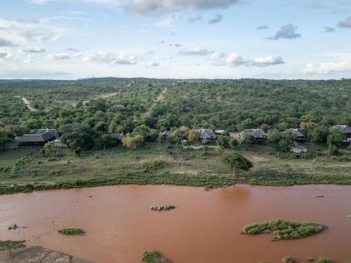an aerial view of a village and a river at Nyati Safari Lodge in Hoedspruit
