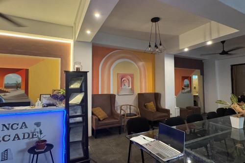 a room with a table with a laptop on it at Franca Arcade near Quezon City Circle in Manila