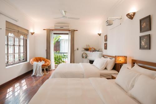 Giường trong phòng chung tại West-Lake Villa - Humi Housing