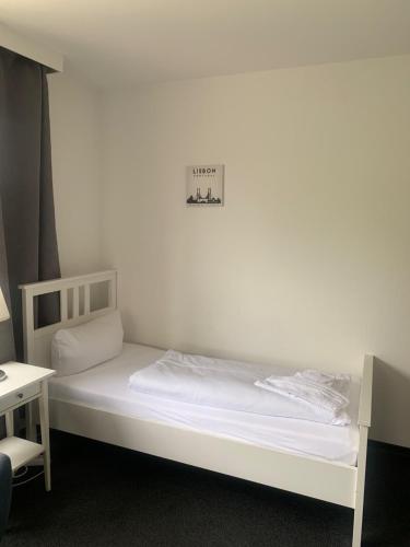 Ένα ή περισσότερα κρεβάτια σε δωμάτιο στο Hotel Calenberger Hof
