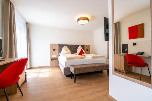 Ein Bett oder Betten in einem Zimmer der Unterkunft Hotel Rosenvilla