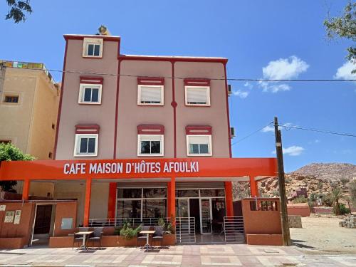 a building with a sign that reads cafe appliances authority at Maison d'hôtes afoulki tafraout in Tafraoute