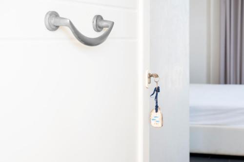 a door with a key hanging from it at Case Vacanze Otranto in Otranto