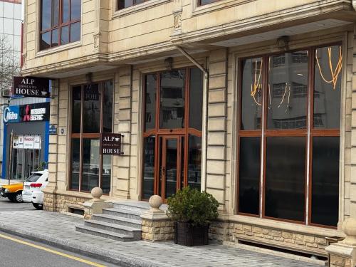a building on the side of a street at Alp Inn Hotel in Baku