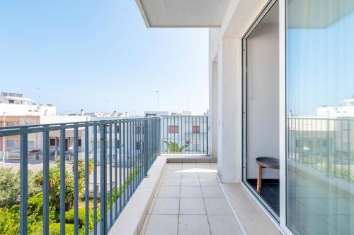 a balcony with a view of a city at Case Vacanze Otranto in Otranto