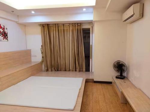 a living room with a large white rug on the floor at R&R Entire Rental Unit in Manila