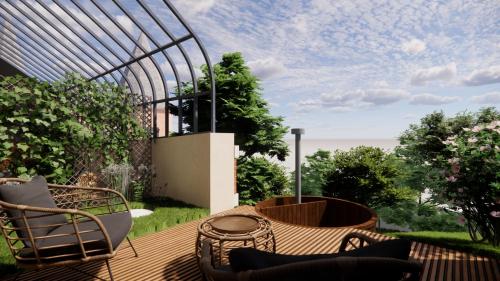 a deck with chairs and a table on a balcony at Château de Perreux, The Originals Collection in Amboise