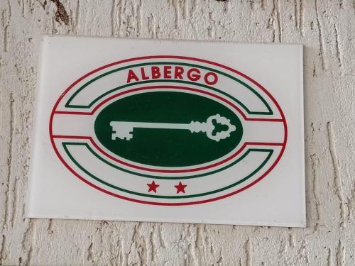 a sign for an albergo sign on a wall at Hotel Silvia Framura - Cinque Terre in Framura