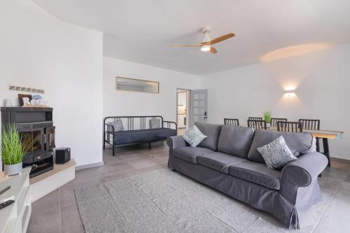 a living room with a couch and a table at Brisa do Rio - Portimao in Portimão