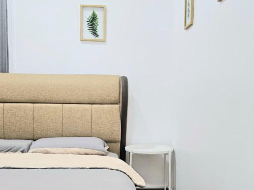 a bedroom with a bed and a side table at Seaview and 5mins to Paddy Field and Beach in Sekincan