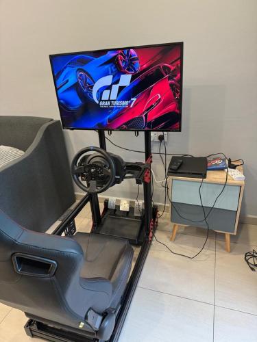 TV a/nebo společenská místnost v ubytování AYAAN GAMING HOME at Quintet Play Free GranTurismo