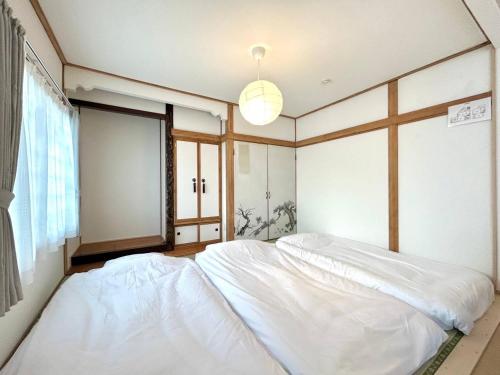 Postel nebo postele na pokoji v ubytování FURANO BnB