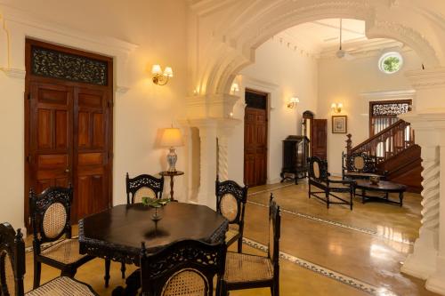 a dining room with a table and chairs at Jetwing Wahawa Walauwa, A Luxury Reserve in Rambukkana