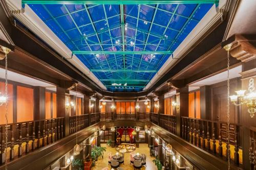 an overhead view of a building with a blue ceiling at Beijing Xiaofengxian Former Residence Hotel Tiananmen Square Qianmen Store in Beijing