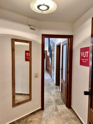 a hallway with two mirrors in a building at ChicFlat Río Ciudad Real Dúplex en el centro in Ciudad Real