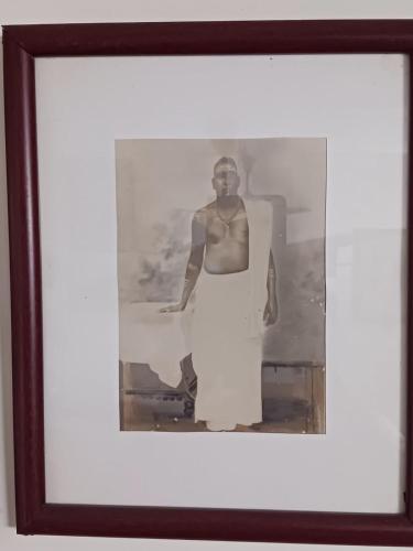 a black and white photo of a woman in a dress at Vintage Vista in Lakkidi