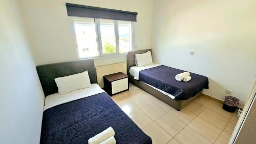 Postel nebo postele na pokoji v ubytování Suburban Family Villa