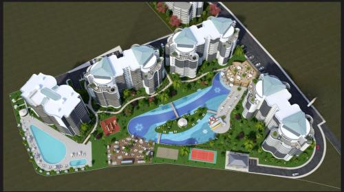 a model of a resort with a pool and buildings at Sunny escape Holiday apartment in İskele