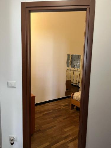 a hallway with a door leading to a room at appartamento genziane in Genova