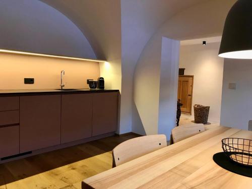 a kitchen and dining room with a table and chairs at Hof Ida in Bach