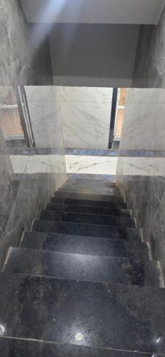 a view of a staircase in a building at Hotel Sangam Palace in Chittaurgarh