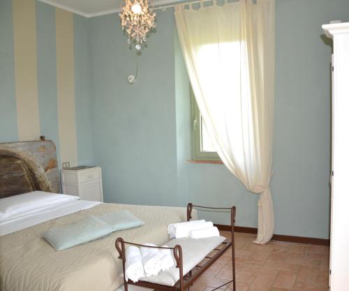 A bed or beds in a room at Casale Dolci Dimore