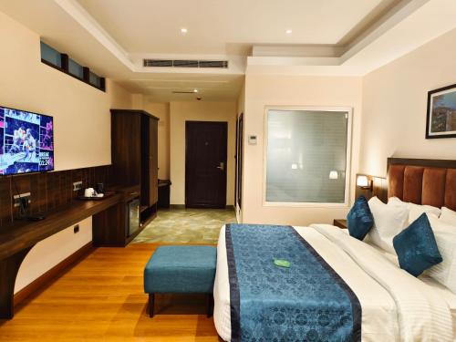 Ένα ή περισσότερα κρεβάτια σε δωμάτιο στο Clarion Hotel De Renees Gangtok
