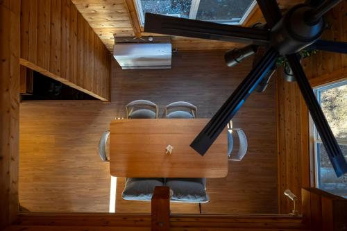 a meeting room with a table and chairs at Calm villa 富士山中湖 in Yamanakako