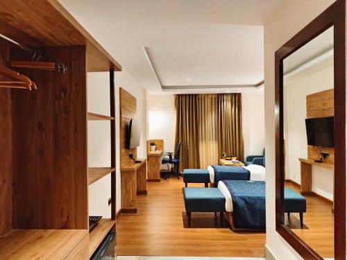 Ένα ή περισσότερα κρεβάτια σε δωμάτιο στο Clarion Hotel De Renees Gangtok