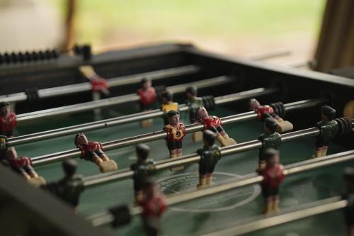 a group of toy figures on a pool table at Xandari Pearl Beach Resort in Mararikulam