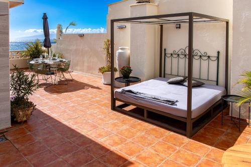 Postel nebo postele na pokoji v ubytování Dachterrassen Wohnung Teneriffa