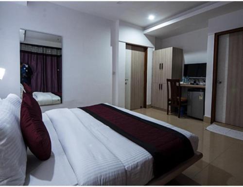 Katil atau katil-katil dalam bilik di The Sirmour Retreat, Nahan