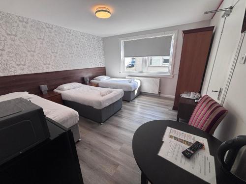 Postel nebo postele na pokoji v ubytování Park View Rooms