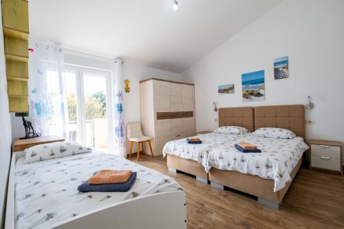 Ένα ή περισσότερα κρεβάτια σε δωμάτιο στο Villa Veronika