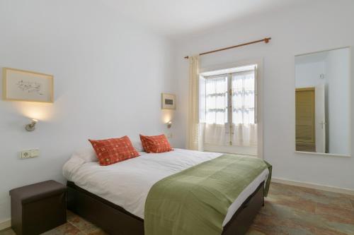 a bedroom with a bed with two pillows on it at Casa la Mayor in Costa Teguise