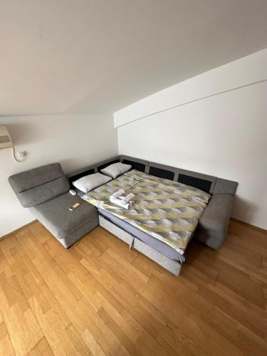 a room with a bed in the corner of a room at Apartment Stex 3 in Podgorica