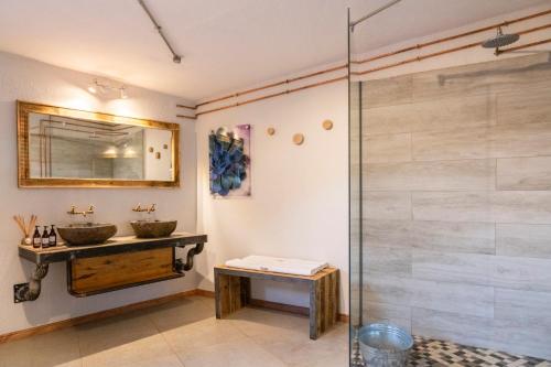 a bathroom with two sinks and a shower at Barkhan Dune Retreat in Solitaire