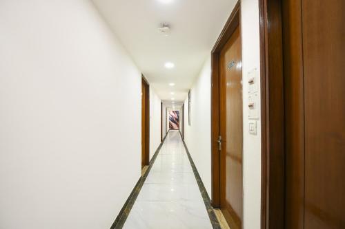 a corridor of a hallway with a long aisle at FabExpress Under Bridge - Near Nizamuddin Railway Station in New Delhi